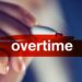 Overtime business concept, businesswoman highlighting word with red marker pen
