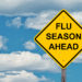 Flu Season Ahead Caution Sign With Blue Sky Background