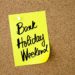 Business Acronym  BHW Bank Holiday Weekend written on yellow paper note pinned on cork board with white thumbtack, copy space available
