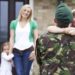 Son Greeting Military Father On Leave At Home