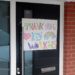 Child's thank you and rainbow painting on door for Coronavirus