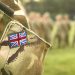 UK flag on soldiers arm. UK military uniform. United Kingdom troops